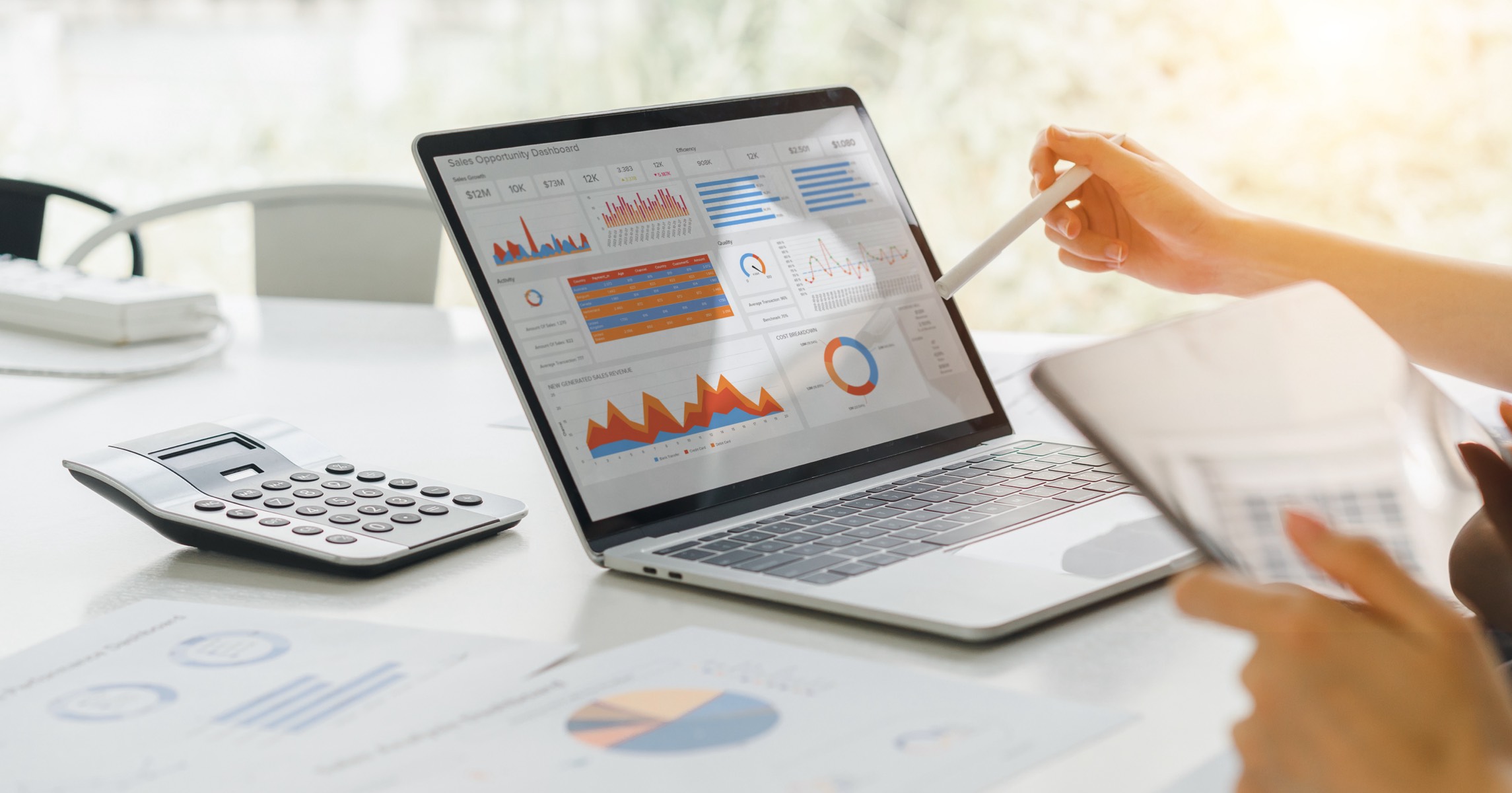 marketing person performing audit on laptop looking at data