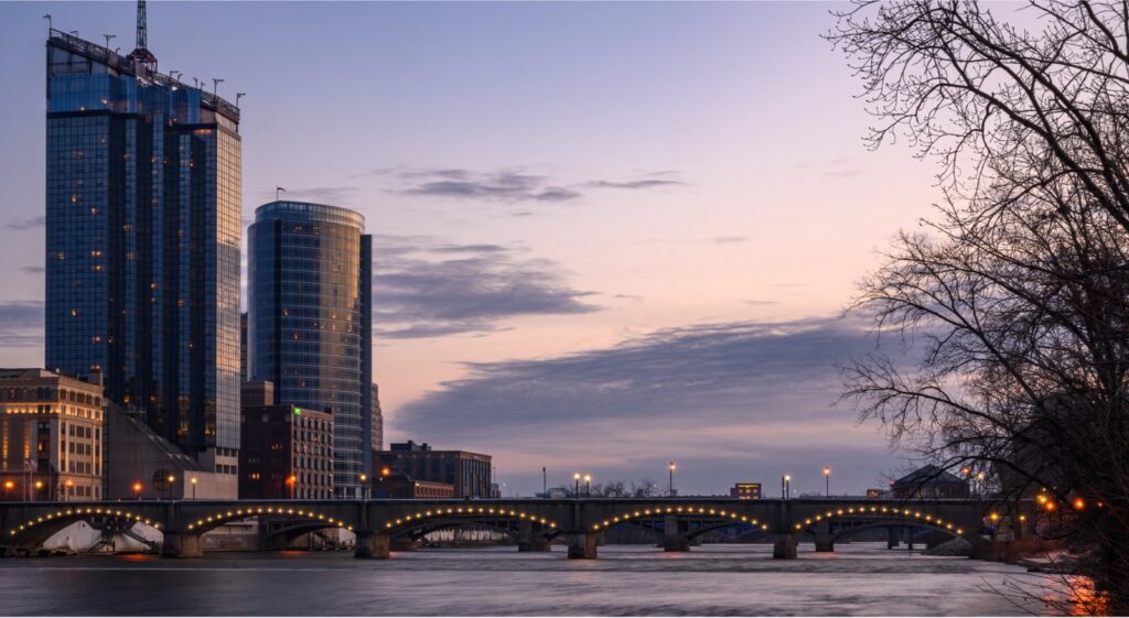 Grand Rapids skyline at sunset representing growth and momentum