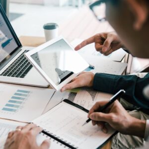 Marketing team reviewing data on paid ads setup