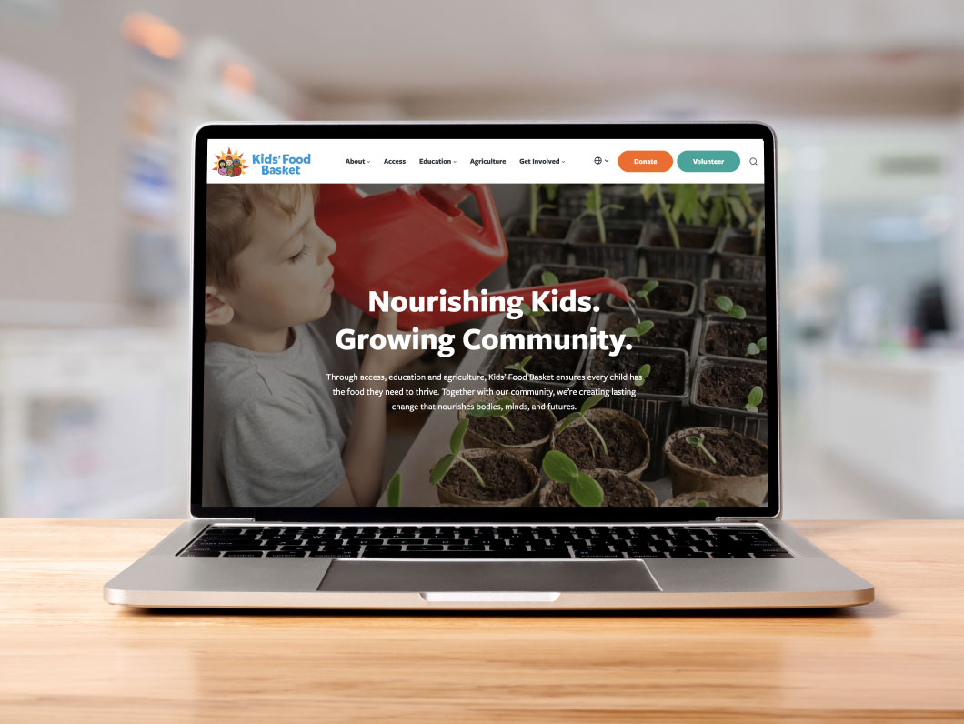 Kids Food Basket Website shown on laptop